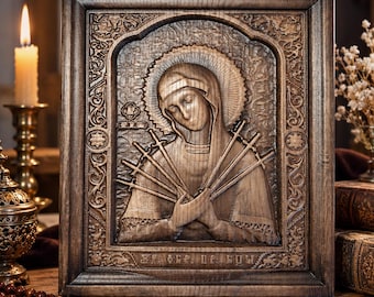 May include: A rectangular wooden wall plaque featuring a relief carving of a figure with a halo, pierced by seven swords. The frame is decorated with intricate scrollwork patterns, and the bottom edge contains carved Cyrillic text.