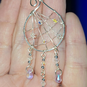 May include: A set of three ceramic mugs with a speckled, matte finish in cream, light grey, and dark grey. Each mug has a minimalist design and a rounded handle. Ideal for tea or coffee.