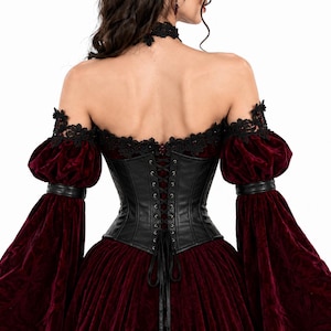 Back view of a Gothic Vampire Queen dress showing a black leather corset with lace-up detail, off-shoulder black lace trim, and puff sleeves with burgundy velvet. Ideal for Gothic cosplay and vampire costumes.