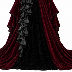 Close-up of the skirt on a Gothic Vampire Queen dress showing layered black leather ruffles cascading over a burgundy velvet skirt with a long train. Victorian Gothic gown detail for cosplay.