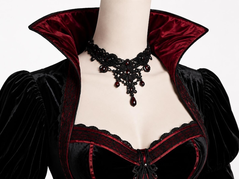 Macro fabric detail showing the realistic velvet pile, directional sheen, fine folds, stitching and burgundy trim of the Gothic gown.