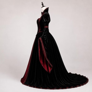 Victorian vampire dress shown from the side, featuring structured corset shaping, puff shoulders, wide bell sleeve, full skirt and natural train.
