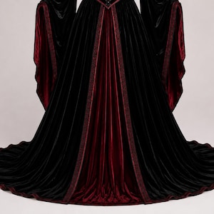 Close-up of the Gothic corset bodice showing rich velvet texture, burgundy trim, sweetheart neckline, stitching and decorative front fasteners.
