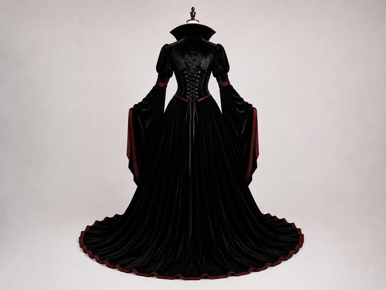 Detailed Victorian high collar and Gothic neckline with burgundy lining, black lace trim and choker detail on the velvet gown.