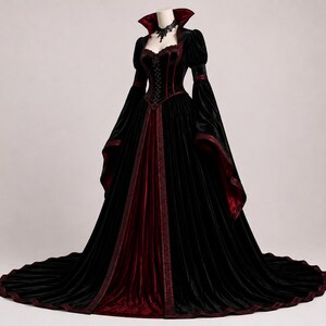 Gothic Victorian gown shown from the back with fitted corset lacing, high collar, structured sleeves, flowing skirt and extended train.