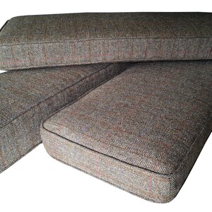 A high quality bench seating cushion made in the UK in west Yorkshire. The cover for the bench cushion was made in a Harris Tweed upholstery fabric which is made in Scotland using 100% wool. The herringbone design fabric is hard wearing and natural. The wool cover for the bench cushion has a zip at the back so it can be removed for washing. The Harris Tweed seat cushion has piped edges. Inside if a firm upholstery foam with dacron on it to give a soft, plump look to the finished cushion.