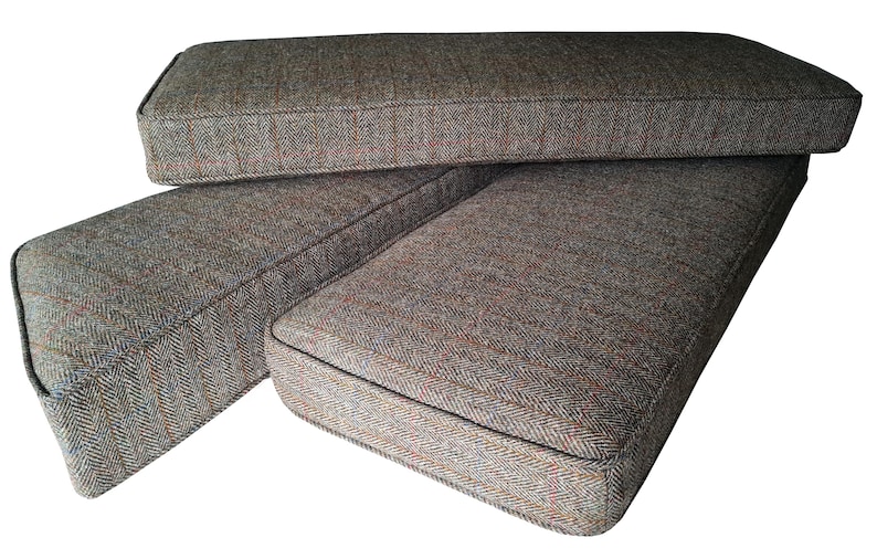 A high quality bench seating cushion made in the UK in west Yorkshire. The cover for the bench cushion was made in a Harris Tweed upholstery fabric which is made in Scotland using 100% wool. The herringbone design fabric is hard wearing and natural. The wool cover for the bench cushion has a zip at the back so it can be removed for washing. The Harris Tweed seat cushion has piped edges. Inside if a firm upholstery foam with dacron on it to give a soft, plump look to the finished cushion.