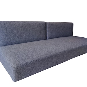 A large set of medium density filled sofa cushions. The thick single seat cushion has dacron on the foam for a soft, supportive cushion. The two back cushions pull out to for a camper van bed set. The camper van cushions have a dark grey, hard wearing fabric cover which has a zip at one long saide so th covers can be washed by machine. Pet friendly, dog safe fabrics which are durable and long lasting. High quality camper van conversion cushions for sprinter van bed systems. Pull out bed cushions