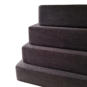 Camper van conversion bed cushions in a dark grey easy care fabric. Performance fabric bench cushion covers for stowaway bed in camper van renovation. Thick, hard wearing, durable firm foam inners. Fire safe. Eco friendly latex option for sleeping on. Cotton, wipe clean, pet friendly van mattress cushions. Shaped around van wall. Bulkhead cushions. Made in the UK by a small family company. Luxury motor home cushion replacement. Sprinter stowaway bed. VW platform bed camper van cushions.