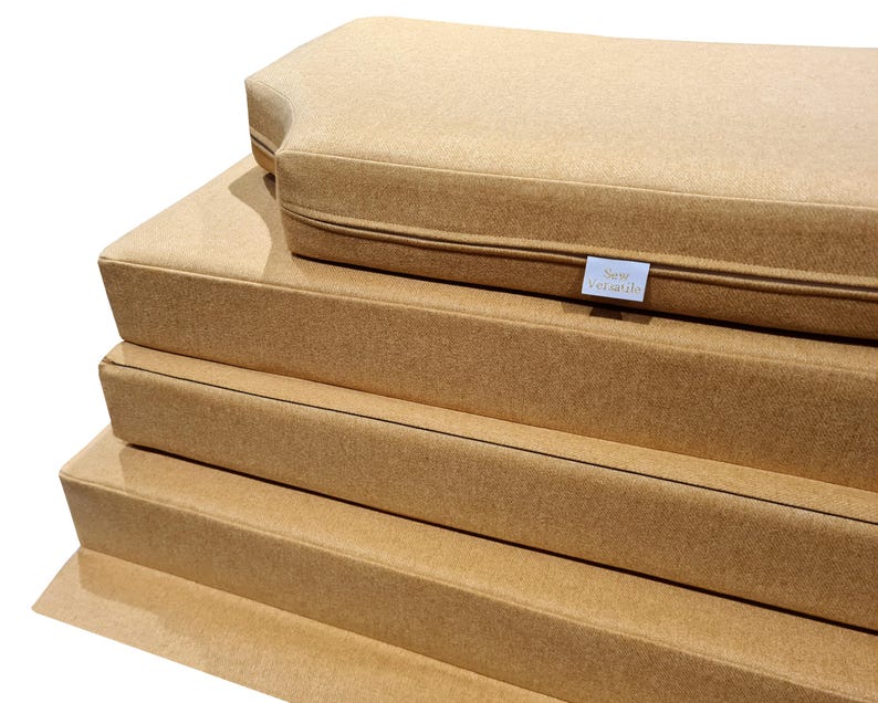 Thick, comfortable bench cushions for replacement motor home sleeping cushions. Firm upholstery foam with memory foam topper. Reflex foam cushions for camper van conversion. Soft, wool feel machine washable bench cushion covers for sitting and sleeping on. Made to measure to fit around odd shapes, van walls and bulkheads. Stowaway pull out plywood van bed cushions with easy care, wipe clean fabric covers. Flaps and panels for screws and nails or velcro, ties and straps to keep cushions in place.