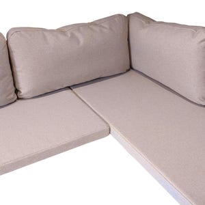 A made to measure banquette seating set - thin firm foam indoor bench cushions with clean, unpiped edges in a light beige coloured wool look fabric that is hard wearing, easy clean and machine washable. Back cushions in soft sofa style filling hollowfibre and duck feather comfortable thick back pads. Bespoke dining room banquette corner seat cushions made in UK. No piping at the edges. Zipper at the back of each bench cushion cover. Neutral coloured bench cushion, griege, fawn coloured fabric