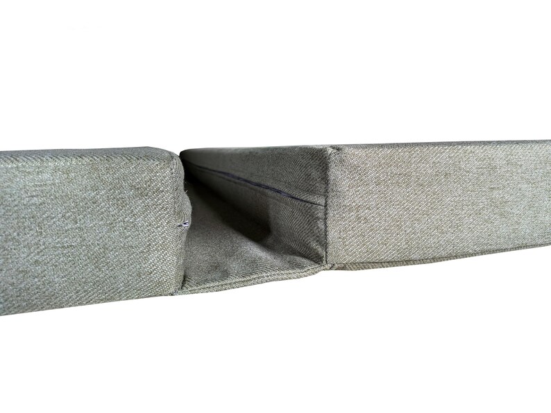 A set of camper van bed cushions with a fabric join to keep the cushions together when pulled out to form a sleeping area. Two thick firm foam camper van cushions in a wool feel, easy care, machine washable upholstery fabric which is durable and pet friendly. Velcro on the backs of the seat and bolster cushion keeps the cushions in place. Long zips at the ends of the foam box edge cushions mean removing the covers for washing is convenient. Made to order, shaping around van walls and bulkheads