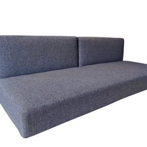 A large set of medium density filled sofa cushions. The thick single seat cushion has dacron on the foam for a soft, supportive cushion. The two back cushions pull out to for a camper van bed set. The camper van cushions have a dark grey, hard wearing fabric cover which has a zip at one long saide so th covers can be washed by machine. Pet friendly, dog safe fabrics which are durable and long lasting. High quality camper van conversion cushions for sprinter van bed systems. Pull out bed cushions