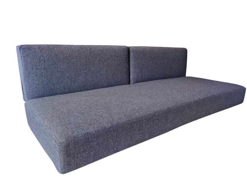 A large set of medium density filled sofa cushions. The thick single seat cushion has dacron on the foam for a soft, supportive cushion. The two back cushions pull out to for a camper van bed set. The camper van cushions have a dark grey, hard wearing fabric cover which has a zip at one long saide so th covers can be washed by machine. Pet friendly, dog safe fabrics which are durable and long lasting. High quality camper van conversion cushions for sprinter van bed systems. Pull out bed cushions