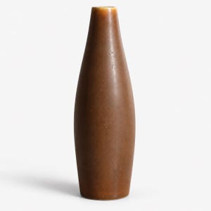 May include: A tall, slender vase with a smooth, matte brown finish. The vessel features a tapered, cylindrical body that narrows slightly toward the top opening, showcasing a consistent, solid earth-toned color throughout its entire surface.