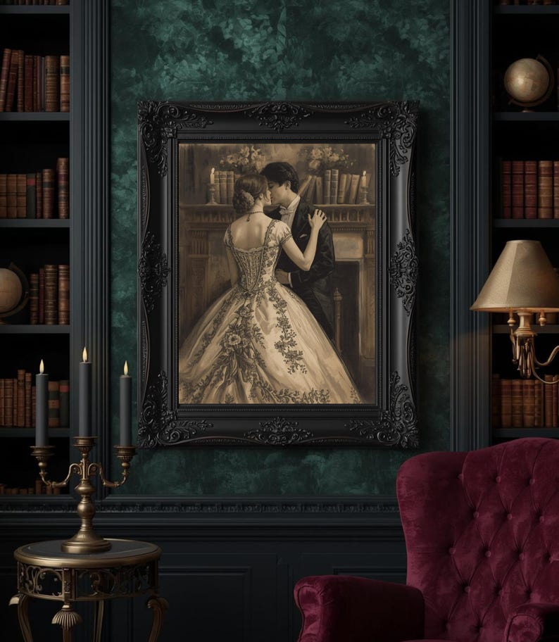 May include: A sepia-toned framed print depicts a couple embracing in a romantic scene. The ornate black frame surrounds the image, which is set against a dark green wall. The room features a bookshelf, candles, and a burgundy armchair.