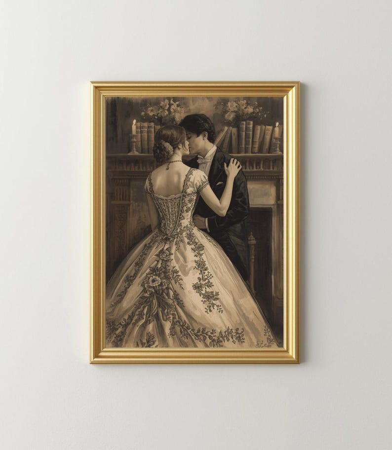 May include: A framed sepia-toned print of a couple embracing. The woman wears a detailed gown with floral embroidery. The man is in a tuxedo. The background features a fireplace, candles, and bookshelves. The frame is gold.