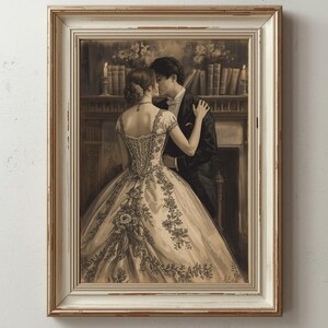 May include: Sepia-toned framed print of a couple embracing. The woman wears a detailed ball gown with floral embroidery. The man is in a tuxedo. The background shows a fireplace, candles, and a bookshelf. The frame is white with a gold trim.
