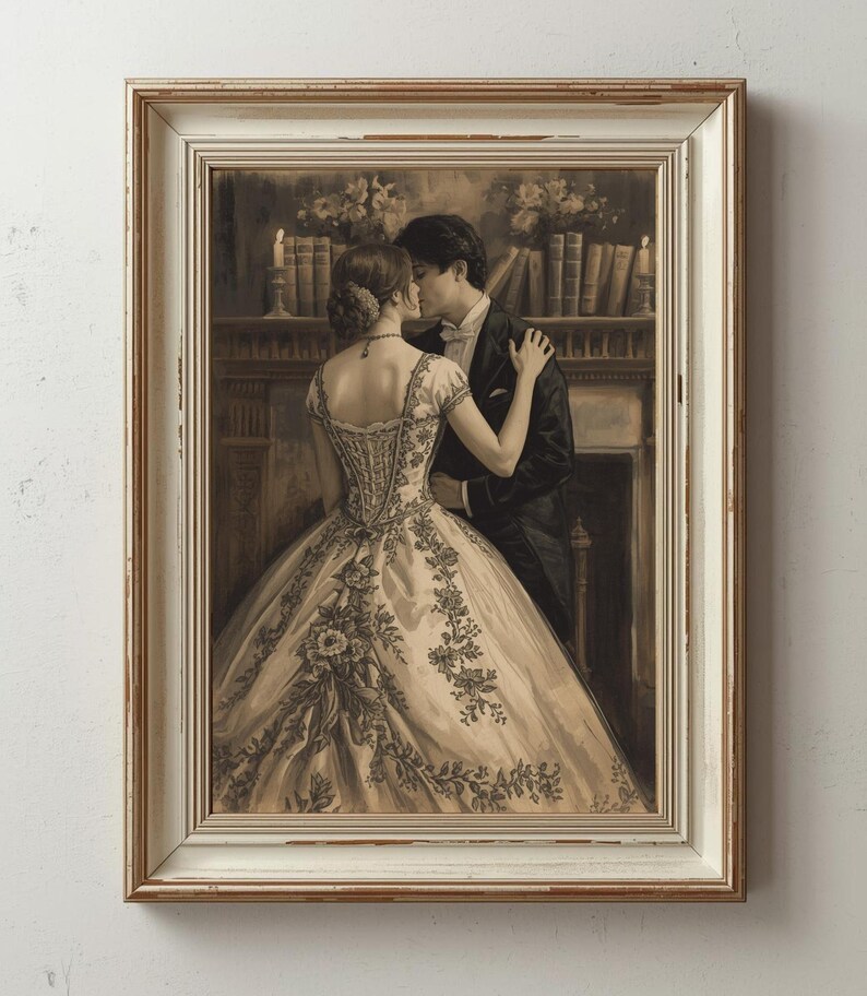 May include: Sepia-toned framed print of a couple embracing. The woman wears a detailed ball gown with floral embroidery. The man is in a tuxedo. The background shows a fireplace, candles, and a bookshelf. The frame is white with a gold trim.