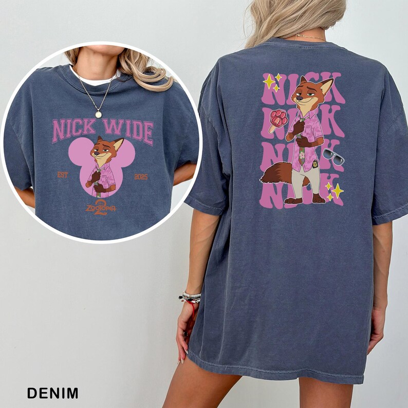 A denim t-shirt with a graphic of a cartoon character, specifically Mickey Mouse, and the text "NICK WIDE" printed on it.