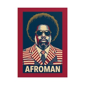 May include: A framed portrait of Afroman. The artwork depicts a man with sunglasses and a large afro. He is wearing a suit with an American flag design. The word "AFROMAN" is printed in white letters on a blue banner.