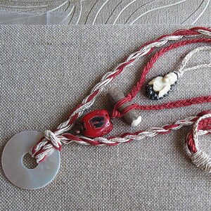Coral & Cream Necklace - silk and linen custom cords feature a vintage Buddha, red coral, an antler button and mother-of-pearl ring