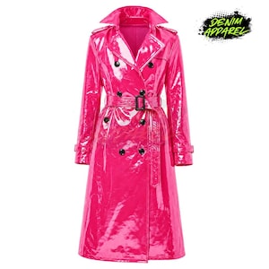 May include: A vibrant, hot pink trench coat with a glossy, patent leather-like finish. The double-breasted coat features a notched collar, a belt at the waist, and black buttons. The text "DENIM APPAREL" is in the upper right corner.