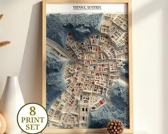 May include: Framed 3D map art print of Vienna, Austria, with a detailed layered design. The artwork features a light wood frame and a cityscape with blue, white, red, and beige tones. The print is labeled "VIENNA, AUSTRIA" at the top and includes a "8 PRINT SET" sticker.