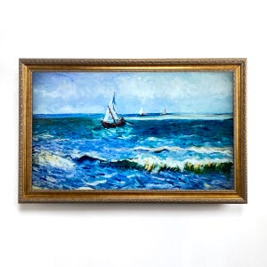 May include: An oil painting of a seascape with sailboats. The artwork features a vibrant blue ocean with white-capped waves, a light blue sky, and several sailboats. The painting is framed in a gold ornate frame.