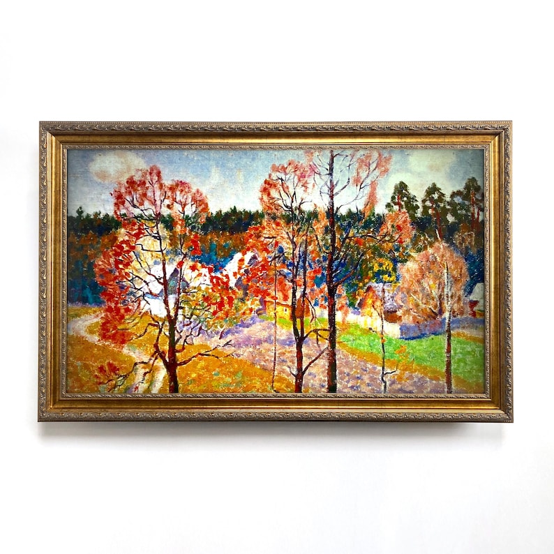 May include: An original landscape painting in a gold ornate frame. The artwork depicts a colorful autumn scene with trees in shades of red, orange, and yellow. A path winds through a field, leading to houses in the distance. The sky is a light blue.