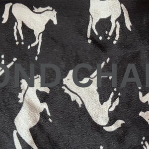 May include: Black fabric with a repeating pattern of white horse silhouettes in various poses. The text "SECOND CHAPTER" is printed across the center of the fabric. The horses are in different positions, some standing, some rearing.