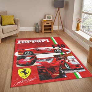 May include: Red rectangular rug with Ferrari F40 car graphics. The rug features a collage design with the Ferrari logo, car images, and text. The rug has a red background with white and green stripes.