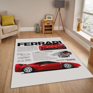 May include: A rectangular rug featuring a red Ferrari F40 sports car illustration. The rug has the text "FERRARI F40" in black and red, along with technical diagrams and text about the car.