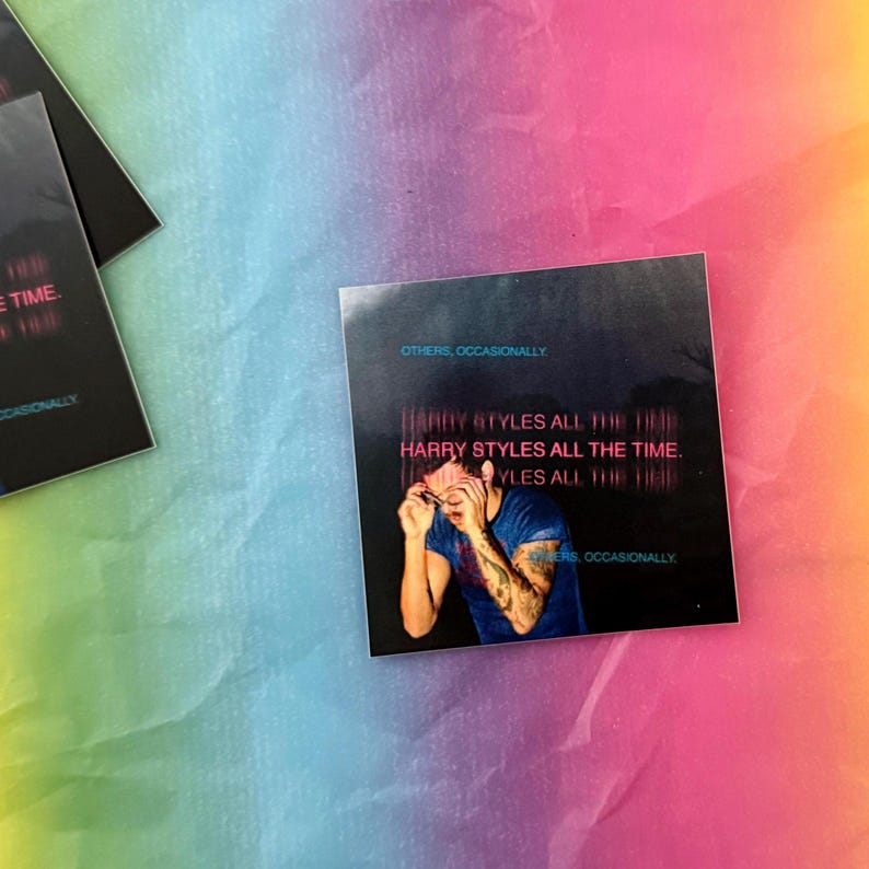 May include: Square sticker featuring a photo of a person with the text "HARRY STYLES ALL THE TIME." The sticker has a dark background with the words "OTHERS, OCCASIONALLY" at the top and bottom. The background is a rainbow of colors.