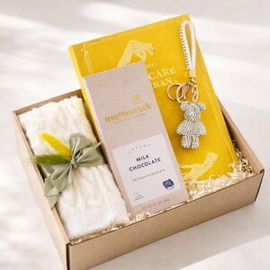 Congratulations gift box with cozy self care items including mug, blanket, candle, notebook and treats. Thoughtful celebration gift for new job, promotion, achievement, milestone, employee appreciation, coworker gift, thank you gift, personalized care package and encouragement gift for women and men.
