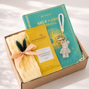 Congratulations gift box with cozy self care items including mug, blanket, candle, notebook and treats. Thoughtful celebration gift for new job, promotion, achievement, milestone, employee appreciation, coworker gift, thank you gift, personalized care package and encouragement gift for women and men.