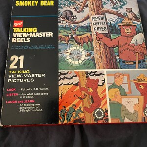 May include: A box of 21 Talking View-Master reels featuring the true story of Smokey Bear. The box features a colourful illustration of Smokey Bear with the text "Prevent Forest Fires".