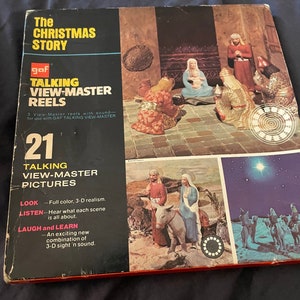 May include: A box containing 3 View-Master reels with sound, depicting the Christmas story. The box is red and black with a picture of the nativity scene on the front. The text on the box reads "The Christmas Story" and "Talking View-Master Reels".
