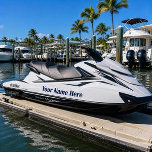 May include: A white and black Yamaha WaveRunner VX personal watercraft featuring a black seat and the text Your Name Here printed on the side. The watercraft is docked on a floating platform in a marina with several boats and palm trees visible.