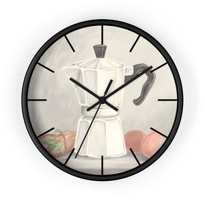 May include: A round wall clock with a black frame. The clock face features a pencil-style illustration of a stovetop espresso maker, with two red-orange fruits and a green-orange fruit. The clock hands are black.
