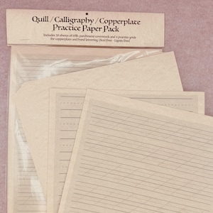 May include: A Quill/Calligraphy/Copperplate Practice Paper Pack in a clear plastic sleeve. The header reads: Quill/Calligraphy/Copperplate Practice Paper Pack. Includes 20 sheets of 65lb. parchment coverstock and 4 practice grids for copperplate and hand lettering (Acid Free - Lignin Free). The paper is light tan with dark brown printed guidelines.