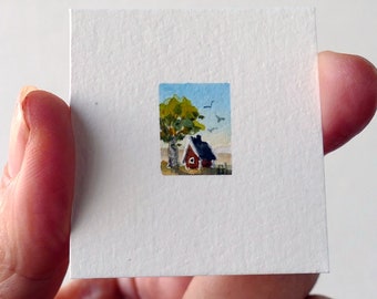 Watercolor miniature art. Tiny landscape painting, blue sky, red house and a tree, original hand-painted, bohemian micro art. Cottage chic