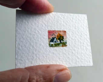 Tiny landscape in sunset, white cottage and tree. Original watercolor miniature painting. Autumn orange colors