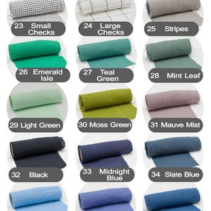 May include: Color chart 2 of 2, featuring fabric rolls in various colors. Includes silver gray, slate gray, small checks, large checks, stripes, emerald isle, teal green, mint leaf, light green, moss green, mauve mist, black, midnight blue, slate blue, pastel blue, lilac bloom, indigo blue, nordic blue, frost blue, and silver.