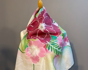 Hand painted silk scarf with tropical flower design, rich pinks and purples with green leaves. The perfect gift, made in France