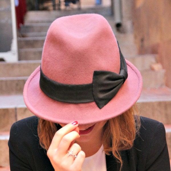 Dusky pink womans fedora hat. Designer French millinery hat. Fashionable womans trilby hat. Pink hat with large black bow.