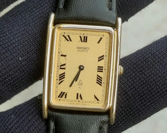 Reloj de cuarzo vintage Seiko Chariot 2620-5010 Tank / Esfera clásica dorada con números romanos