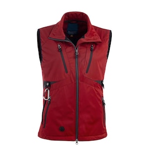 May include: A red vest with a full-length zipper, multiple black zippered pockets, and a black collar. The vest has a small silver carabiner clip on the left side and a small logo on the lower right.
