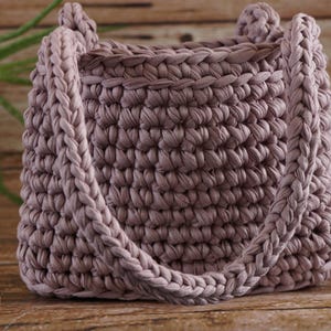 Close-up of crochet stitches using t-shirt yarn highlighting chunky texture and durability