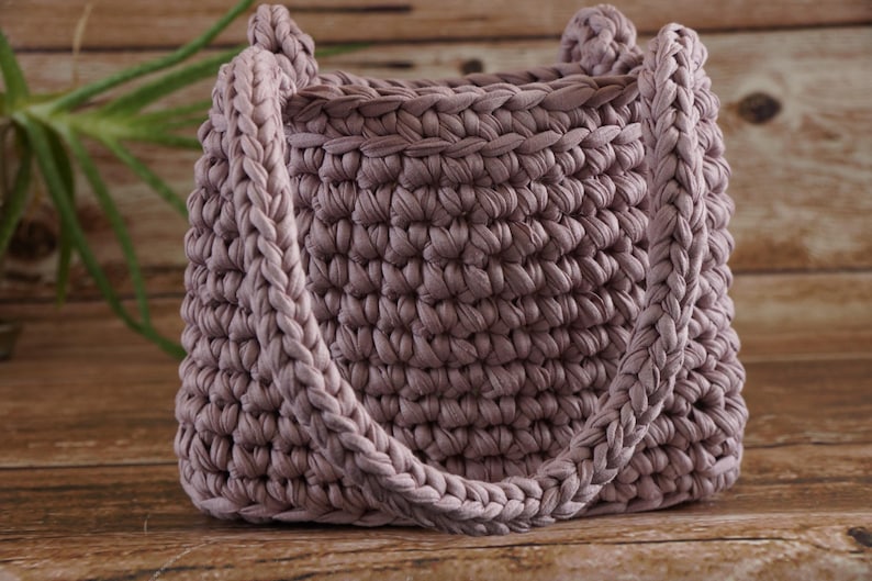 Close-up of crochet stitches using t-shirt yarn highlighting chunky texture and durability